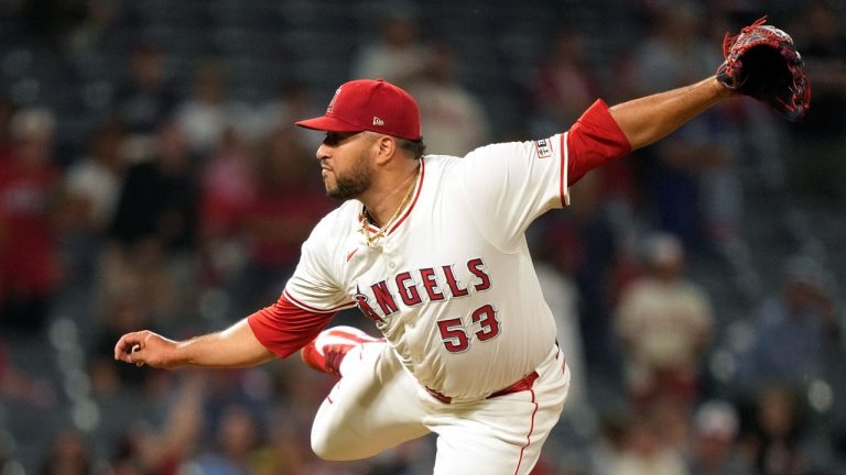 Los Angeles Angels relief pitcher Carlos Estevez throws to the plate during the ninth inning of a game against the Texas Rangers, July 10, 2024. (AP Photo/Mark J. Terrill)