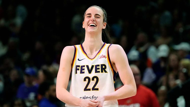 Indiana Fever guard Caitlin Clark laughs as she talks with Phoenix Mercury's Diana Taurasi prior to a WNBA basketball game, Sunday, June 30, 2024, in Phoenix. (Ross D. Franklin/AP)