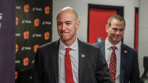 Calgary Flames General Manager Craig Conroy, right, and Ryan Huska enter a news conference in Calgary, June 12, 2023. THE CANADIAN PRESS/Jeff McIntosh