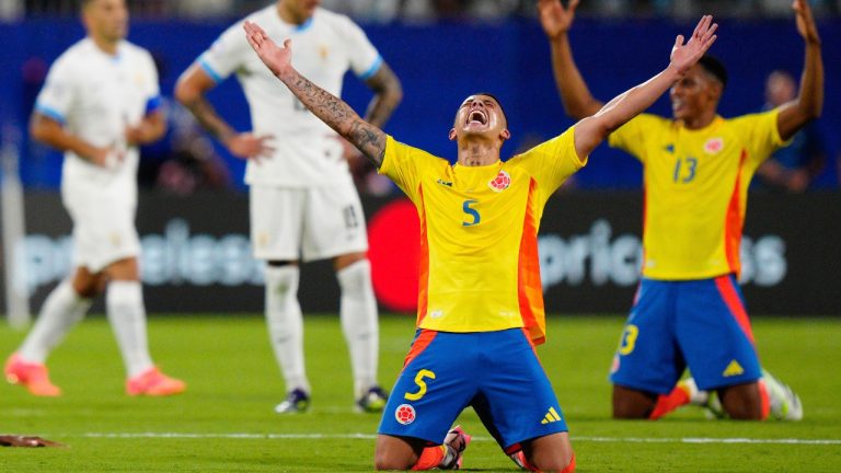 Colombia's Kevin Castano celebrates defeating Uruguay in a Copa America semifinal soccer match in Charlotte, N.C., Wednesday, July 10, 2024. (AP/Jacob Kupferman)