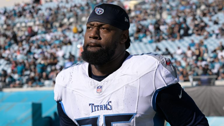 Tennessee Titans defensive end Denico Autry runs onto the field prior to the second half of an NFL game against the Jacksonville Jaguars, Nov. 19, 2023. (AP Photo/Phelan M. Ebenhack)