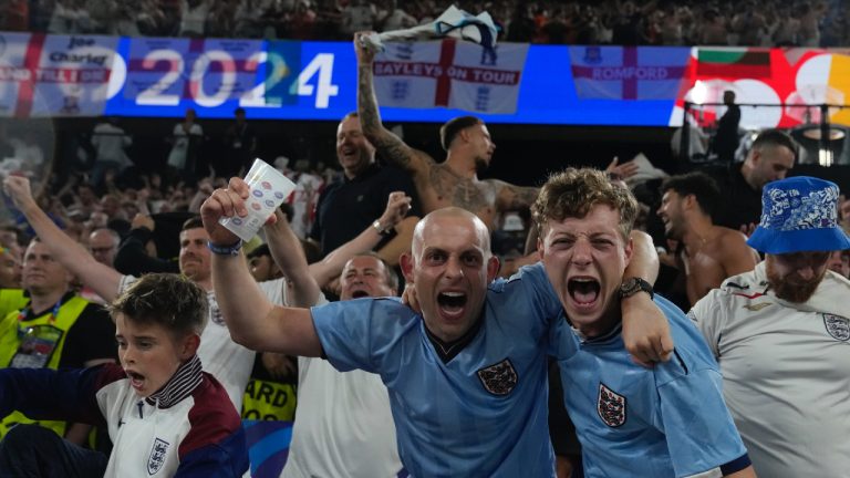 England's fans celebrate at the end of a semifinal against Netherlands at the Euro 2024 soccer tournament in Dortmund, Germany, Wednesday, July 10, 2024. (Thanassis Stavrakis/AP)