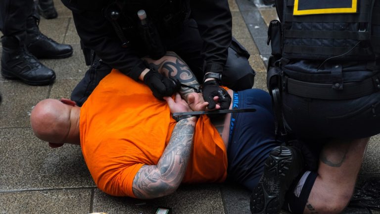 Police officers detain a soccer fan ahead of a semi final match between Netherlands and England at the Euro 2024 soccer tournament in Dortmund, Germany, Wednesday, July 10, 2024. (Markus Schreiber/AP)