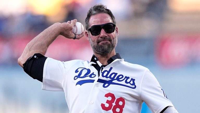 Former Los Angeles Dodgers reliever Eric Gagne throws out the first pitch prior to a game between the Dodgers and the Arizona Diamondbacks, July 3, 2024. (AP Photo/Mark J. Terrill)