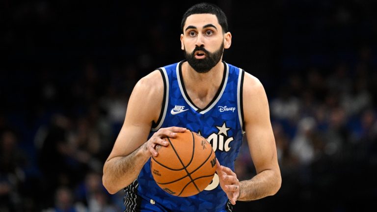 Orlando Magic center Goga Bitadze controls the ball during the second half of an NBA basketball game against the Detroit Pistons, Sunday, March 3, 2024, in Orlando, Fla. (AP Photo/Phelan M. Ebenhack)