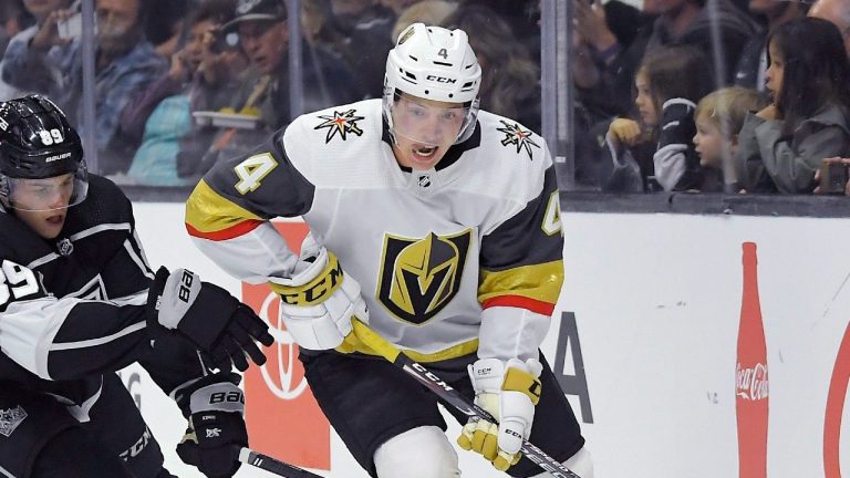 Vegas Golden Knights defenseman Jimmy Schuldt moves the puck while under pressure during a preseason NHL game against the Los Angeles Kings, Sept. 19, 2019. (AP Photo/Mark J. Terrill)