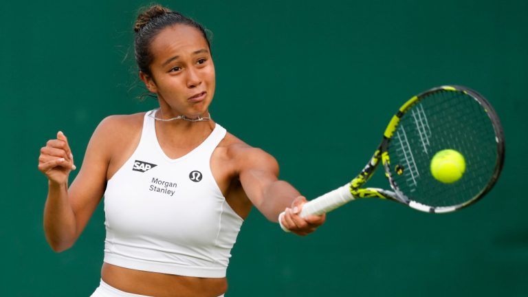 Leylah Fernandez of Canada plays a forehand return to Lucia Bronzetti of Italy during their first-round match at the Wimbledon tennis championships in London, Tuesday, July 2, 2024. (Kirsty Wigglesworth/AP)