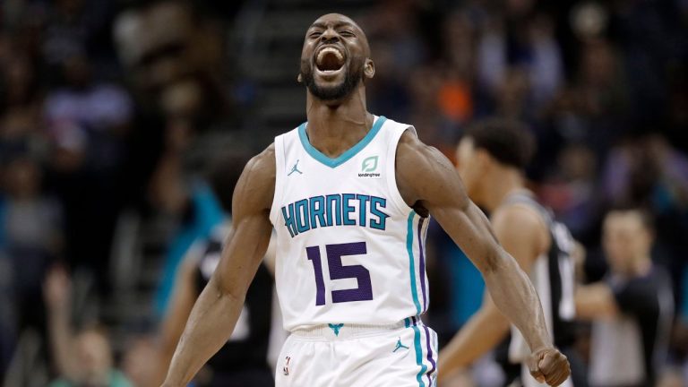 Charlotte Hornets' Kemba Walker reacts after making a basket against the San Antonio Spurs during the second half of an NBA basketball game in Charlotte, N.C., Tuesday, March 26, 2019. (Chuck Burton/AP Photo)