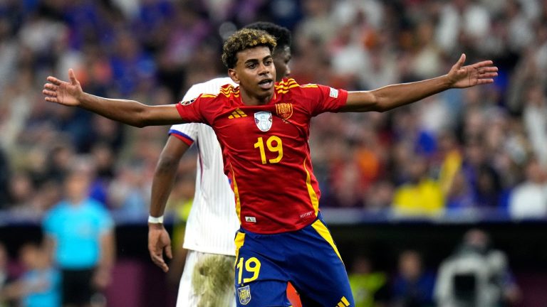 Spain's Lamine Yamal reacts during a semifinal match between Spain and France at the Euro 2024 soccer tournament in Munich, Germany, Tuesday, July 9, 2024. Left Spain's Rodri. (AP/Hassan Ammar)