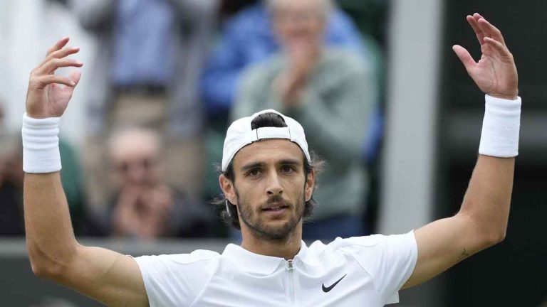 Lorenzo Musetti of Italy celebrates after defeating Giovanni Mpetshi Perricard of France in their fourth round match at the Wimbledon tennis championships. (Mosa'ab Elshamy/AP)
