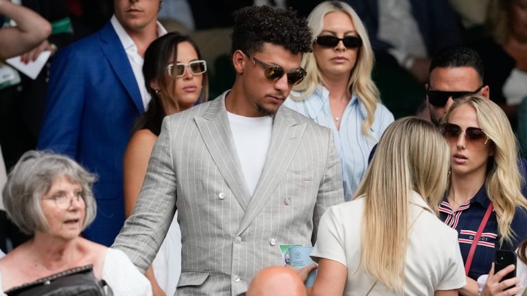 Patrick Mahomes and his wife Brittany, right, arrive on Centre Court for the third round matches at the Wimbledon tennis championships. (Alberto Pezzali/AP)