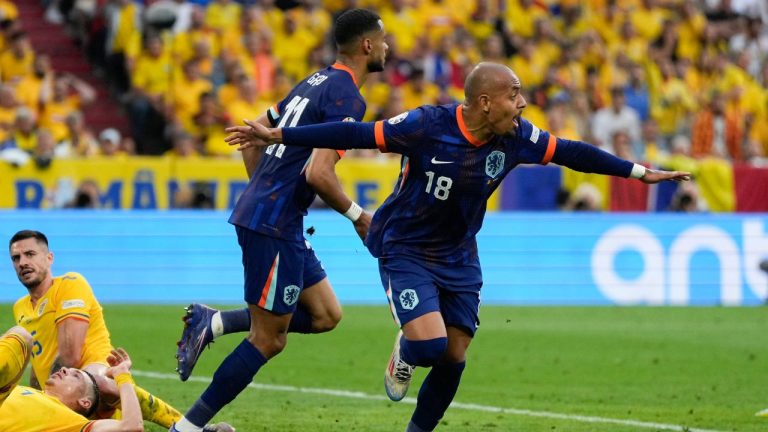 Donyell Malen of the Netherlands celebrates scoring his side's 2nd goal during a round of sixteen match between Romania and the Netherlands at the Euro 2024 soccer tournament in Munich, Germany, Tuesday, July 2, 2024. (Matthias Schrader/AP Photo)