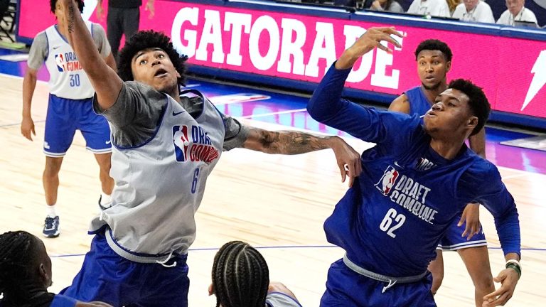 Team Herscu's Izan Almansa, center, reaches for a rebound as Team Forehn-Kelly's Ulrich Chomche (62) watches during the NBA draft combine 5-on-5 basketball game in Chicago, Wednesday, May 15, 2024. (Nam Y. Huh/AP)