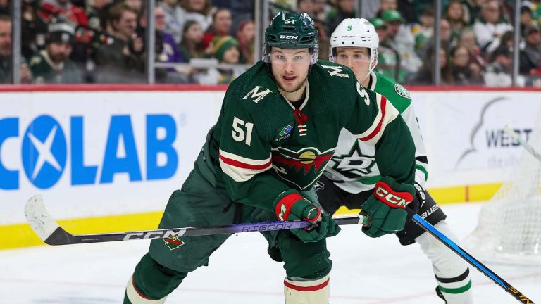 Minnesota Wild right wing Adam Raska, left, and Dallas Stars defenseman Nils Lundkvist (5) compete for position during the third period of an NHL hockey game Monday, Jan. 8, 2024, in St. Paul, Minn. (Matt Krohn/AP)