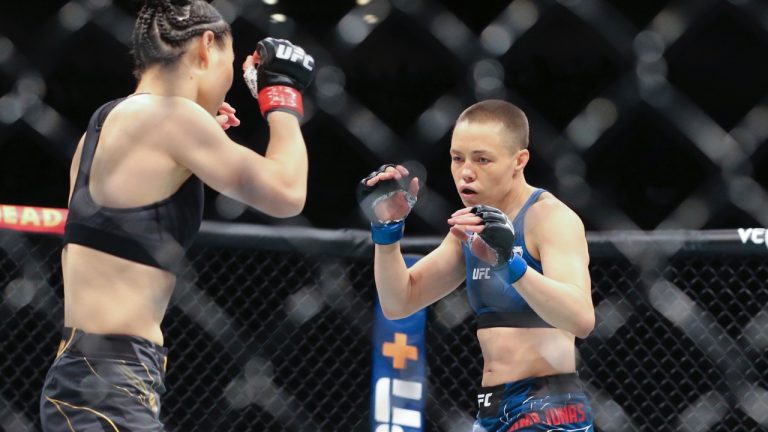 Rose Namajunas, right, and Zhang Weili move around the octagon during a UFC 261 strawweight championship mixed martial arts bout on April 24, 2021, in Jacksonville, Fla. (Gary McCullough/AP)