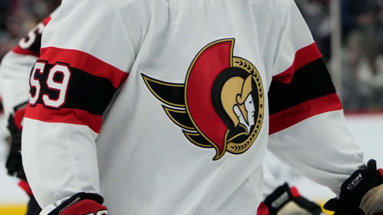 Ottawa Senators left wing Angus Crookshank (59) has the team logo displayed on the front of his sweater in the third period of an NHL hockey game Thursday, Dec. 21, 2023, in Denver. (David Zalubowski/AP)