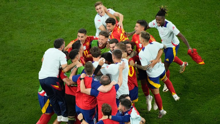 Spain's players celebrate their victory at the end of a semifinal match between Spain and France at the Euro 2024 soccer tournament in Munich, Germany, Tuesday, July 9, 2024. (Ebrahim Noroozi/AP)