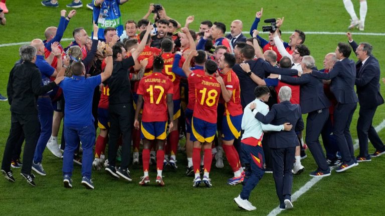 Spain's players celebrate after their team defeated England 2-1 at the end of the final match at the Euro 2024 soccer tournament in Berlin, Germany, Sunday, July 14, 2024. (Thanassis Stavrakis/AP Photo)