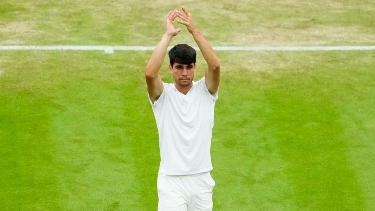 Spain's Carlos Alcaraz celebrates after defeating Francis Tiafoe of the United States in their third round match at the Wimbledon tennis championships in London, July 5, 2024. (AP Photo/Mosa'ab Elshamy)