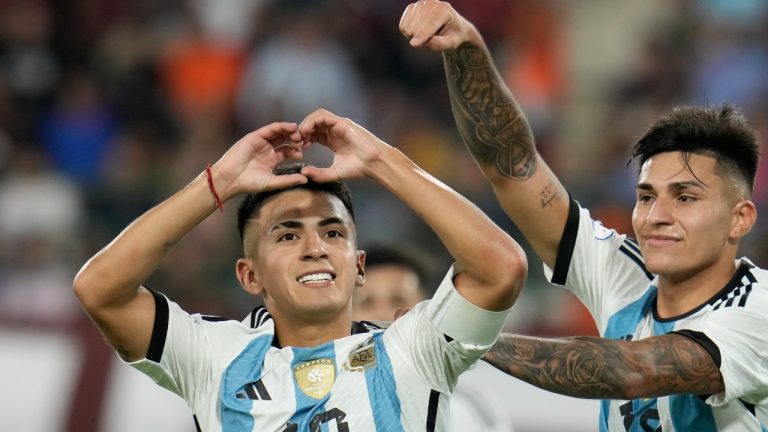 Argentina's Thiago Almada, left, celebrates after he scored his team's second goal against Venezuela during South America's under-23 pre-Olympic tournament match, Feb. 5, 2024. (AP Photo/Ariana Cubillos)