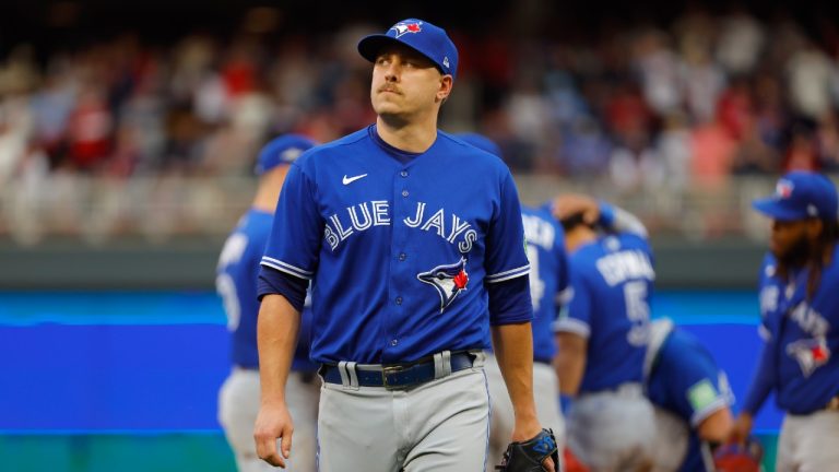 FILE - Toronto Blue Jays pitcher Erik Swanson walks to the dugout during a pitching change in the seventh inning of Game 2 of an AL wild-card baseball playoff series against the Minnesota Twins, Wednesday, Oct. 4, 2023, in Minneapolis. Swanson has left the team to be with his family after his son, Toby, was hit by a car Sunday., Feb. 25, 2024. (Bruce Kluckhohn/AP)