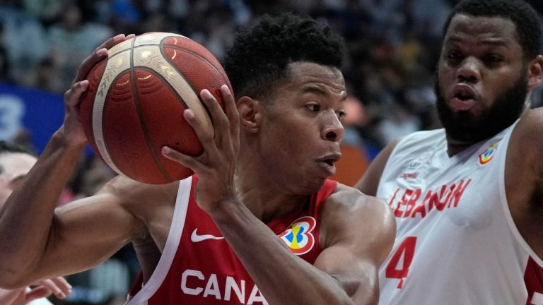 Canada guard Trae Bell-Haynes drives against Lebanon forward Omari Spellman during the Basketball World Cup group H match between Canada and Lebanon at the Indonesia Arena stadium in Jakarta, Indonesia, Aug. 27, 2023. (AP Photo/Dita Alangkara)