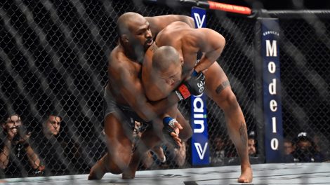 Jon-Jones-takes-down-Ciryl-Gane-during-a-UFC-285-mixed-martial-arts-heavyweight-title-bout-in-Las-Vegas