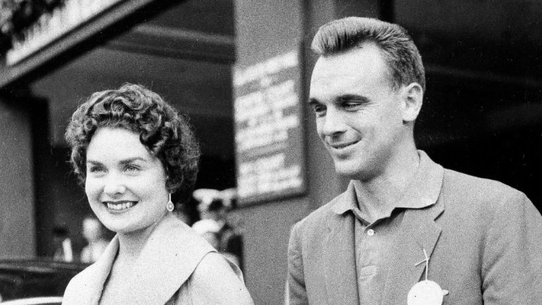 Vic Seixas of Philadelphia and his wife Dolly arrive for the start of the Wimbledon Tennis Championships at Wimbledon, England, June 20, 1955. (AP Photo/File)