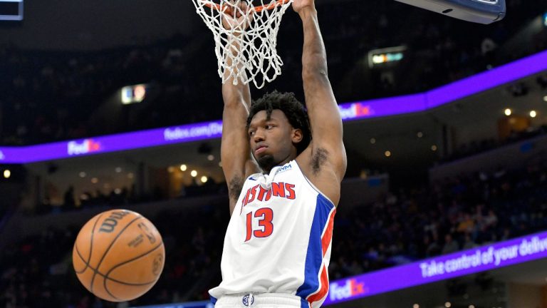 Detroit Pistons center James Wiseman hangs from the rim during the first half of the team's NBA basketball game against the Memphis Grizzlies on Friday, April 5, 2024, in Memphis, Tenn. (Brandon Dill/AP Photo)