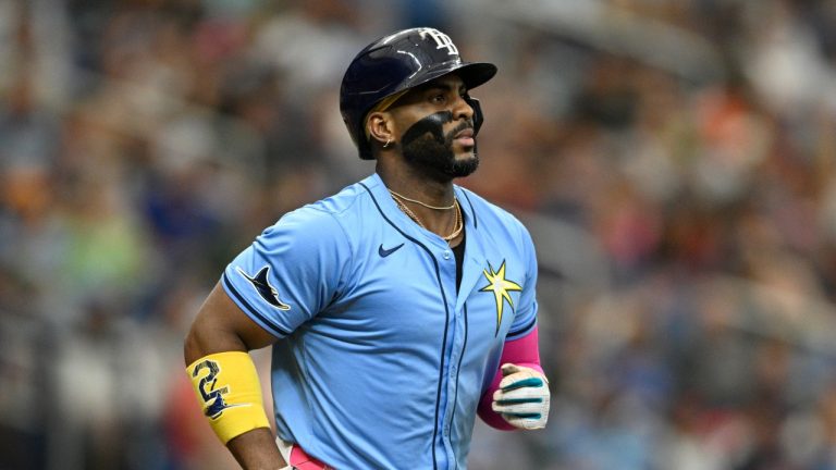 Tampa Bay Rays' Yandy Díaz runs after hitting during the seventh inning of a game against the Cleveland Guardians, July 14, 2024. (AP Photo/Phelan M. Ebenhack)