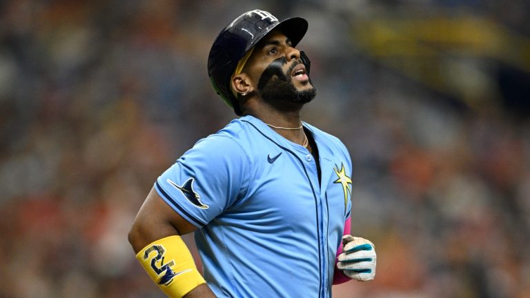 Tampa Bay Rays' Yandy Díaz reacts after hitting a fly ball for an out during the seventh inning against the Cleveland Guardians, July 14, 2024. (AP Photo/Phelan M. Ebenhack)