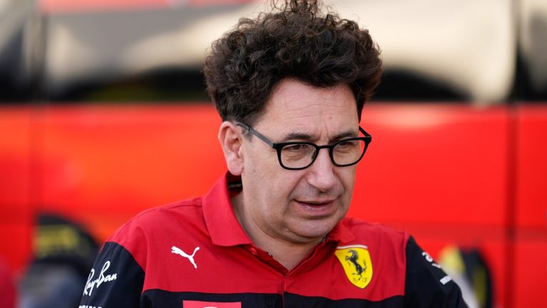 Ferrari team principal Mattia Binotto talks with a crew member in the paddock at the Formula One U.S. Grand Prix auto race at Circuit of the Americas, Thursday, Oct. 20, 2022, in Austin, Texas. (Charlie Neibergall/AP)