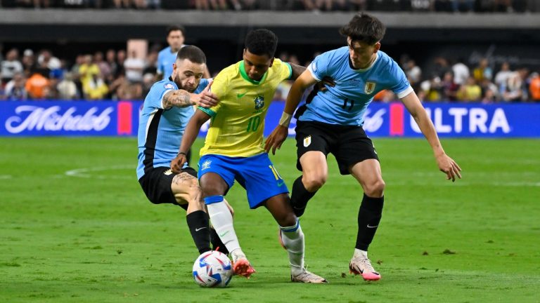 Uruguay's Nahitan Nandez, left, and Facundo Pellistri fight for the ball with Brazil's Rodrygo during a Copa America quarterfinal soccer match in Las Vegas, Saturday, July 6, 2024. (David Becker/AP Photo)