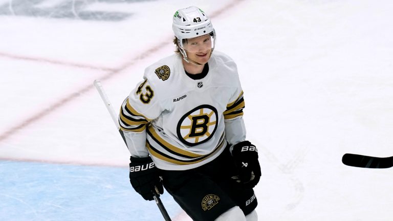 Boston Bruins' Danton Heinen smiles after scoring an empty-net gaol against the Pittsburgh Penguins during the third period of an NHL hockey game Saturday, April 13, 2024, in Pittsburgh. (Matt Freed/AP)