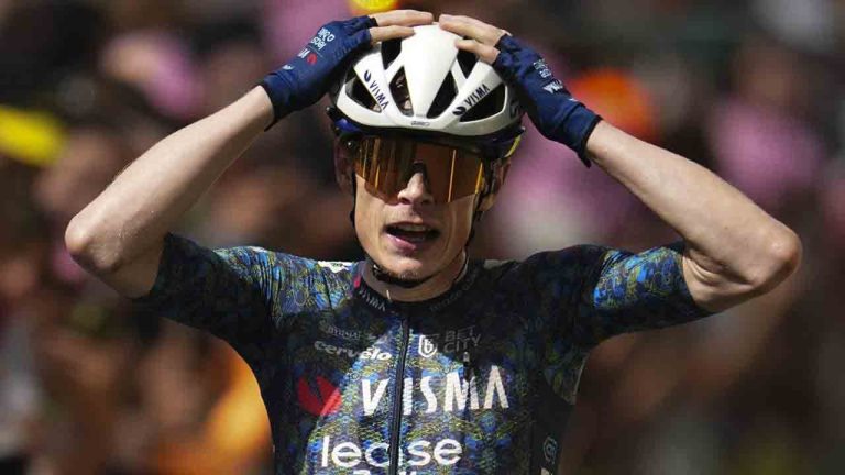 Stage winner Denmark's Jonas Vingegaard celebrates as he crosses the finish line of the eleventh stage of the Tour de France cycling race over 211 kilometers (131.1 miles) with start in Evaux-les-Bains and finish in Le Lorian, France, Wednesday, July 10, 2024. (Daniel Cole/AP)