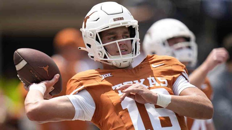 Texas quarterback Arch Manning (16) warms up before an NCAA college football game against Rice in Austin, Texas, Saturday, Sept. 2, 2023. Manning announced Tuesday, July 9, 2024, his likeness will be used in EA Sports College Football 25 following reports he had declined the game developer's offer to be featured in it. (Eric Gay/AP)