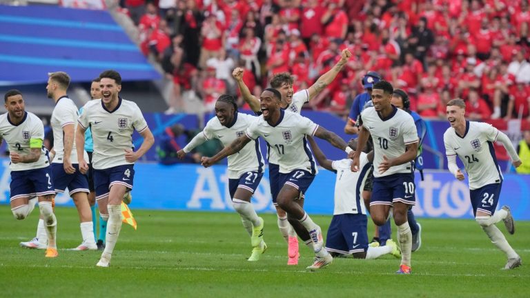 England players celebrate after Trent Alexander-Arnold scored the winning goal during the penalty shootout of a quarterfinal match between England and Switzerland at the Euro 2024 soccer tournament in Duesseldorf, Germany, Saturday, July 6, 2024. (Martin Meissner/AP)