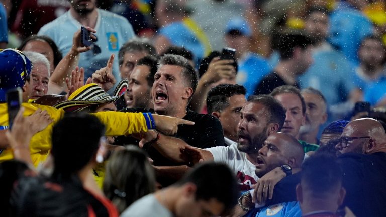 Uruguay's players argue with fans at the end of a Copa America semifinal soccer match against Colombia in Charlotte, N.C., Wednesday, July 10, 2024. (Julia Nikhinson/AP Photo)