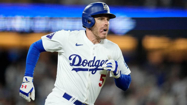 Los Angeles Dodgers' Freddie Freeman heads to first after hitting a grand slam during the eighth inning of a baseball game against the Boston Red Sox Friday, July 19, 2024, in Los Angeles. (Mark J. Terrill/AP)