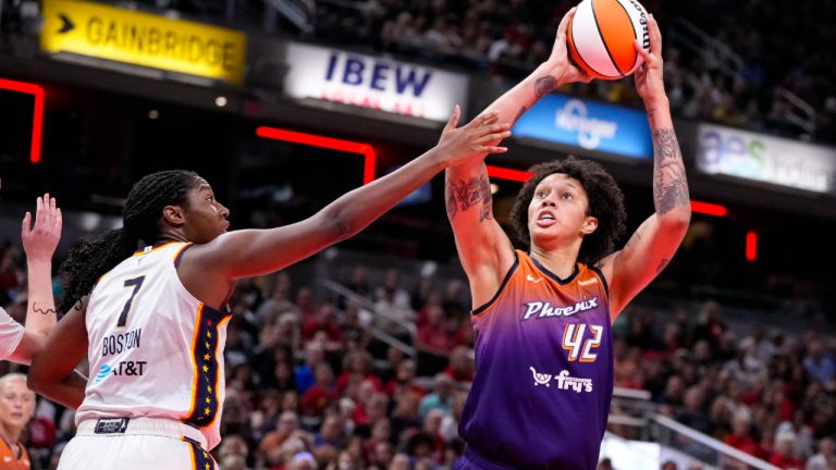 Phoenix Mercury center Brittney Griner (42) shoots over Indiana Fever forward Aliyah Boston (7) in the first half of a WNBA basketball game in Indianapolis, Friday, July 12, 2024. (Michael Conroy/AP)