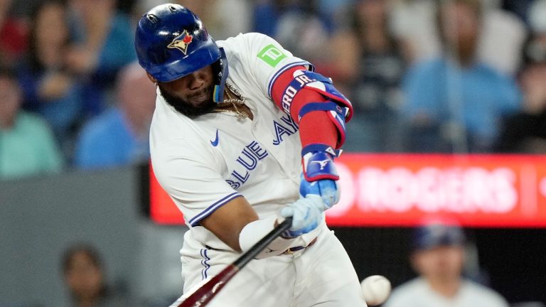 Toronto Blue Jays first base Vladimir Guerrero Jr. (27) hits a two-run home run during first inning American League MLB baseball action against the New York Yankees, in Toronto, Friday, June 28, 2024. (Chris Young/CP)