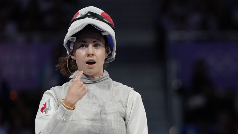 Eleanor Harvey of Canada reacts after winning the bronze medal match against Alice Volpi of Italy in women's foil individual fencing in Paris, France on Sunday, July 28, 2024. (Christinne Muschi/THE CANADIAN PRESS)