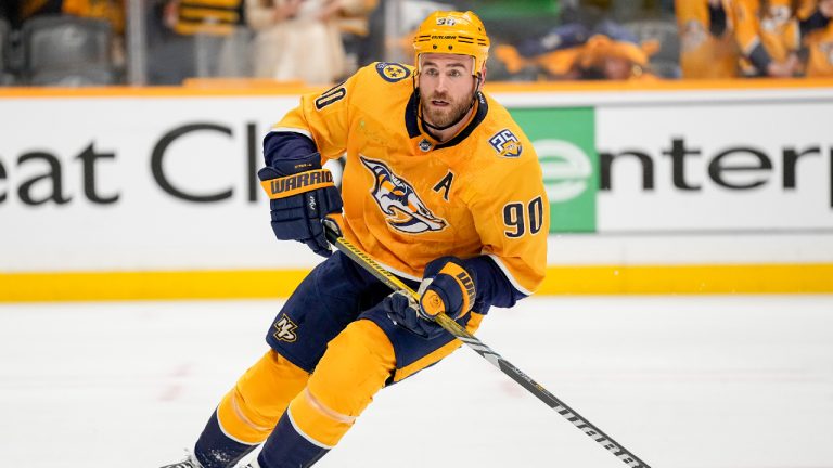 Nashville Predators center Ryan O'Reilly (90) warms up before the start of Game 6 against the Vancouver Canucks in an NHL hockey Stanley Cup first-round playoff series Friday, May 3, 2024, in Nashville, Tenn. (George Walker IV/AP)