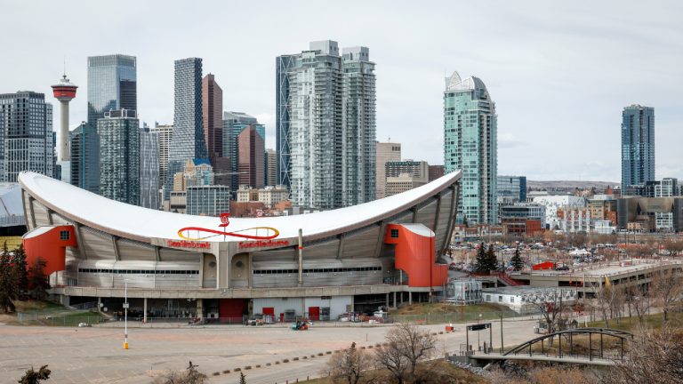 The Scotiabank Saddledome is shown with Calgary's downtown area in the background on Tuesday, April 25, 2023. (Jeff McIntosh/CP)