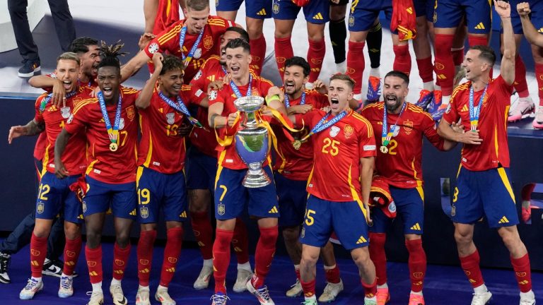 Spain's Alvaro Morata lifts the trophy after winning the final match against England at the Euro 2024 soccer tournament in Berlin, Germany, Sunday, July 14, 2024. (Thanassis Stavrakis/AP)