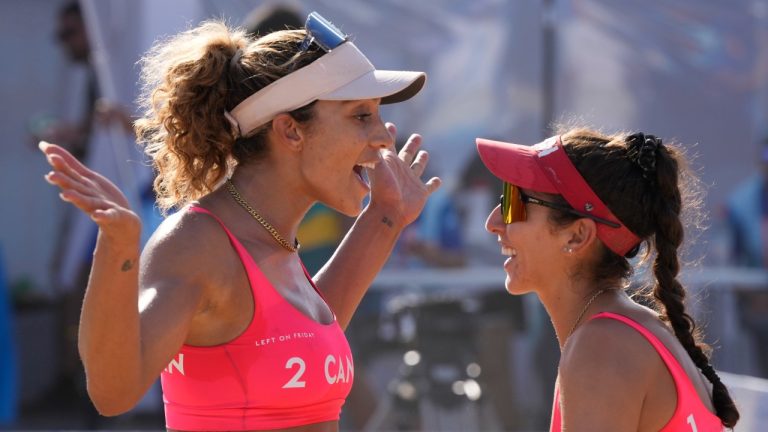 Canada's Melissa Humana-Paredes and Brandie Wilkerson, left, react during beach volleyball action against Argentina at the Pan American Games in Santiago, Chile on Thursday Oct. 26, 2023. (Frank Gunn/THE CANADIAN PRESS)