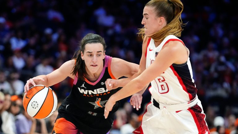 Caitlin Clark, left, of Team WNBA, dribbles against Sabrina Ionescu (6), of Team USA, during the second half of a WNBA All-Star basketball game Saturday, July 20, 2024, in Phoenix. (Ross D. Franklin/AP)