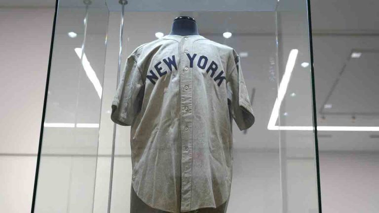 The 1932 Babe Ruth game worn New York Yankees World Series "Called Shot" jersey is displayed in a sealed glass box at Heritage Auction in Irving, Texas, Wednesday, Aug. 21, 2024. (LM Otero/AP)