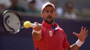 Serbia's Novak Djokovic returns the ball to Spain's Carlos Alcaraz during the men's singles tennis final at the Roland Garros stadium during the 2024 Summer Olympics, Sunday, Aug. 4, 2024, in Paris, France. (Manu Fernandez/AP)