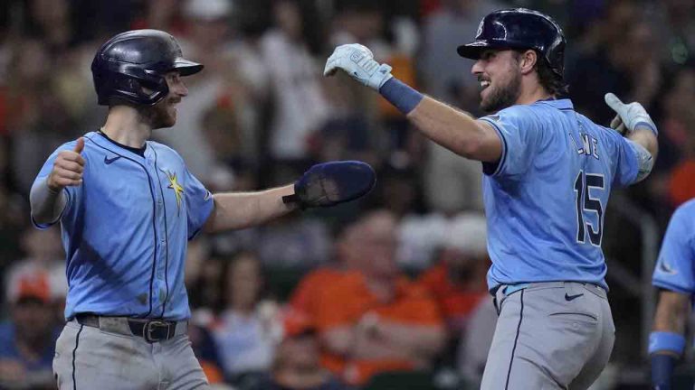 Tampa Bay Rays' Josh Lowe, right, celebrates with Brandon Lowe, left after hitting a two-run home run during the fifth inning of a baseball game against the Houston Astros, Saturday, Aug. 3, 2024, in Houston. (Kevin M. Cox/AP)